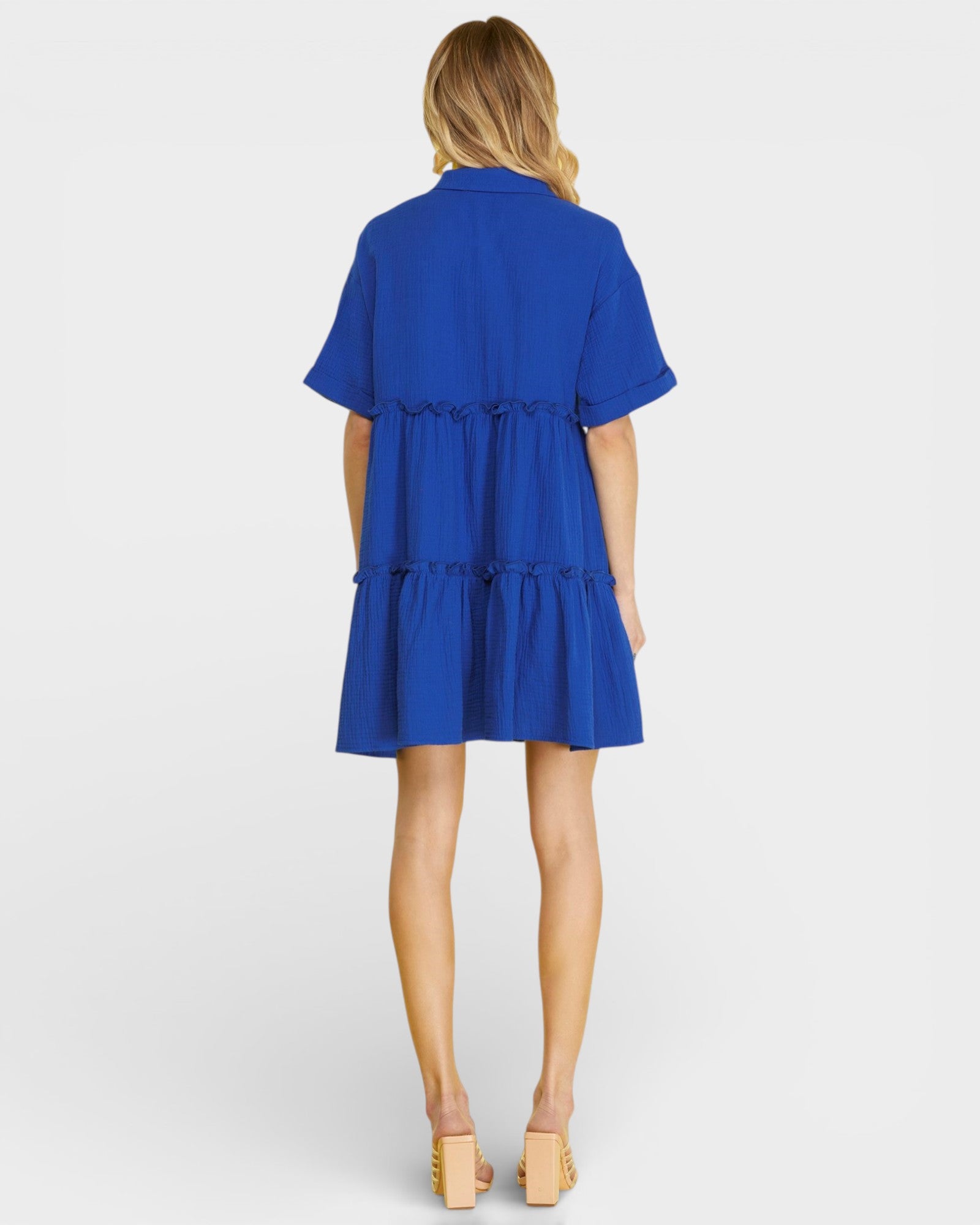 Blue dress worn by a model on a white background