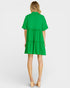 Green dress worn by a model on a white background