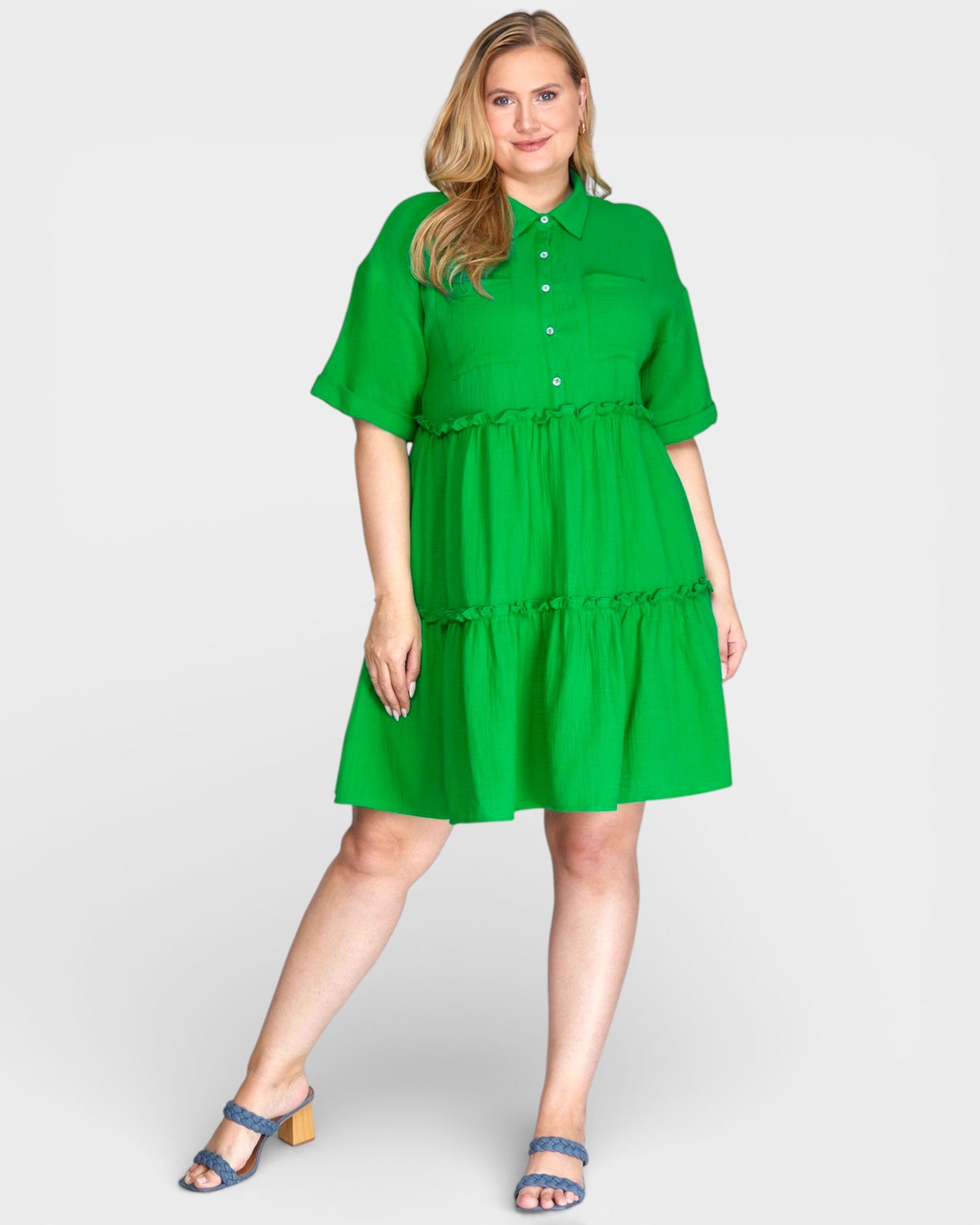 Woman wearing a green dress on a white background