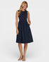 Woman wearing a navy blue dress on a white background