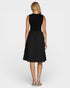 Woman wearing a black sleeveless dress on a white background