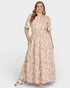 Woman wearing a floral dress on a white background