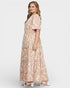 Woman wearing a floral dress on a white background