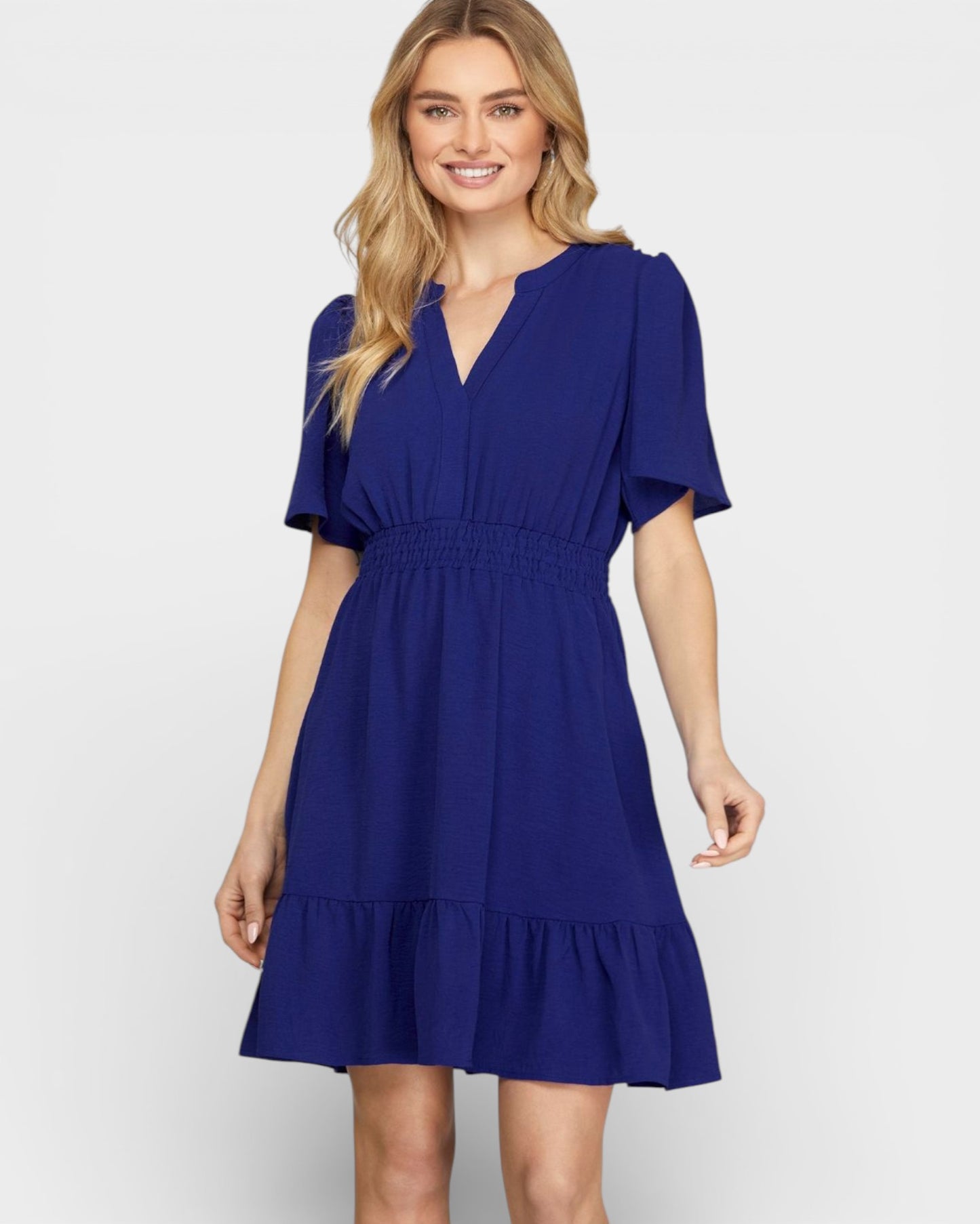 Woman wearing a blue dress on a white background