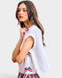 woman wearing white blouse with red white and blue bows