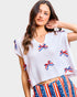 woman wearing white blouse with red white and blue bows