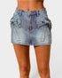 Denim skirt with bow details on a white background