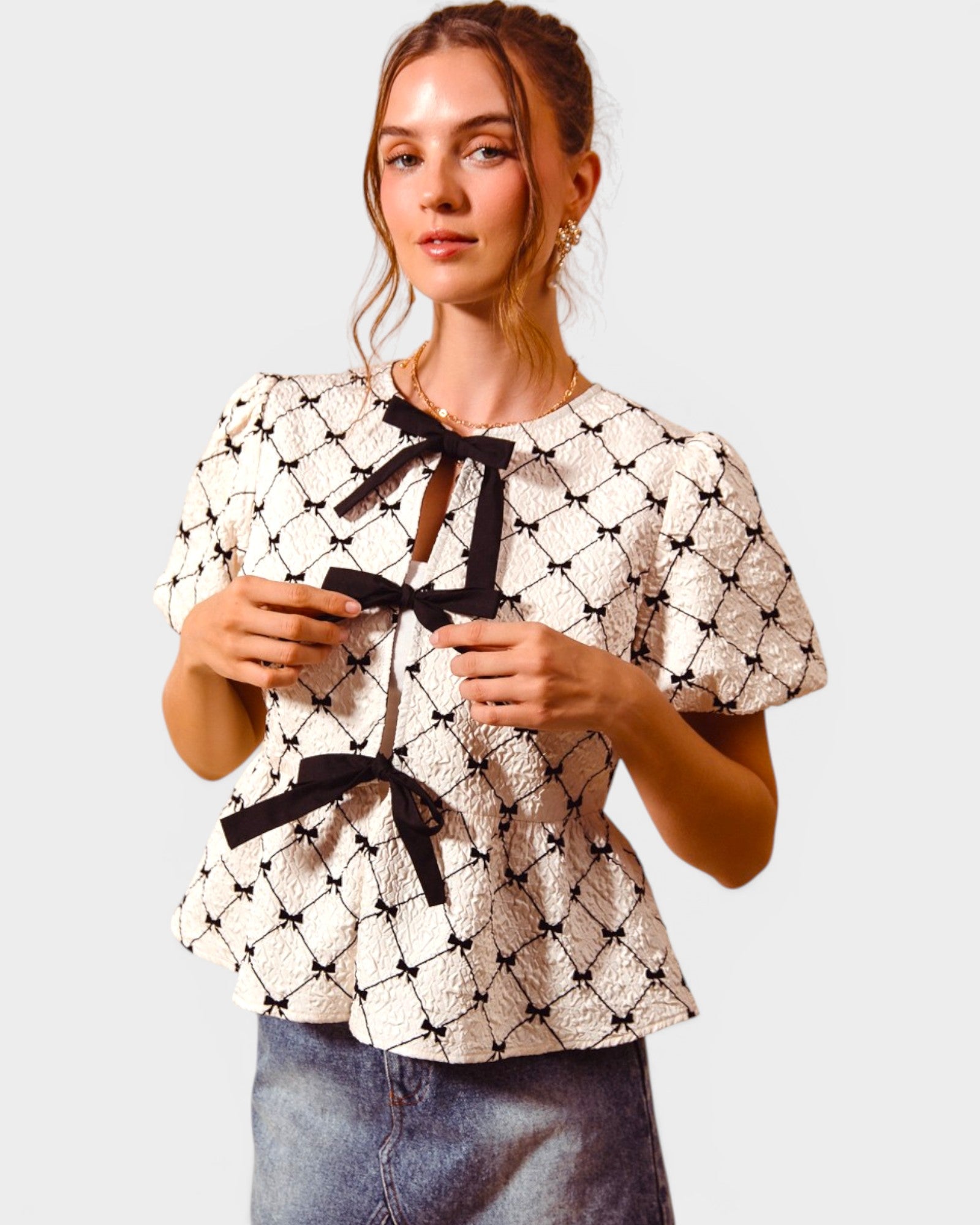 Ivory & Black Bow Peplum Top