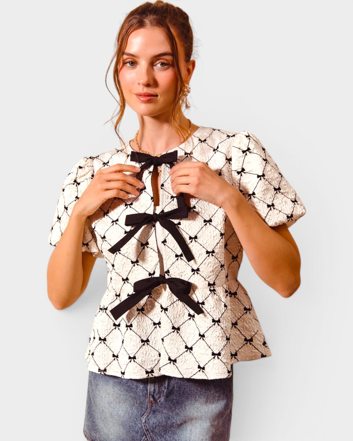 Ivory & Black Bow Peplum Top