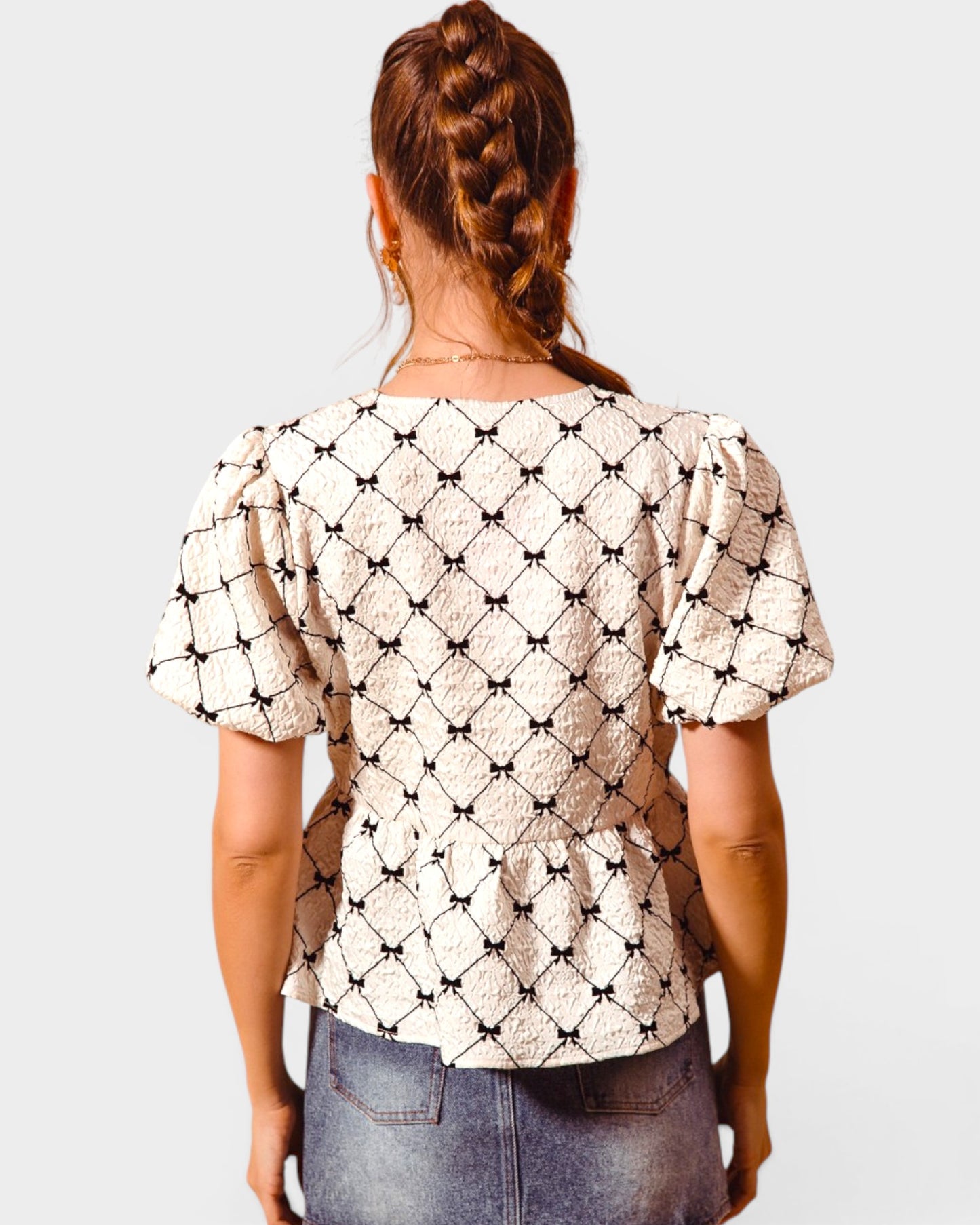 Ivory & Black Bow Peplum Top