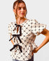 Ivory & Black Bow Peplum Top