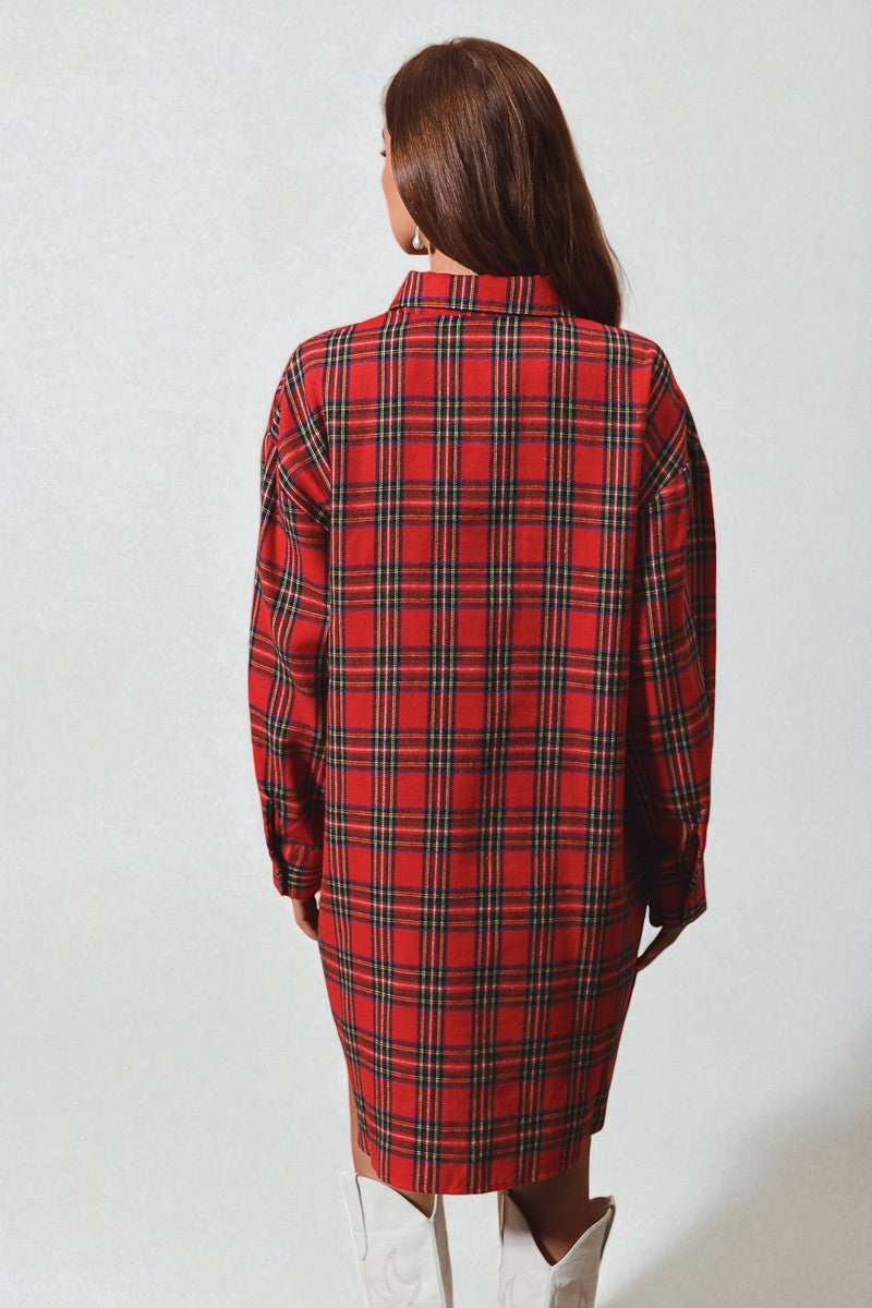 Person wearing a red plaid coat on a white background