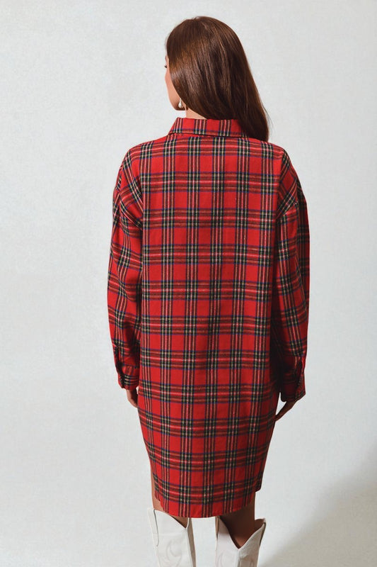 Person wearing a red plaid coat on a white background