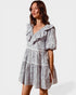 Woman wearing a floral dress on a white background