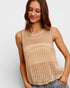 Woman wearing a beige knitted sleeveless top on a white background