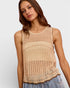 Woman wearing a beige crochet tank top against a plain background