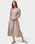 Woman wearing a patterned dress on a white background