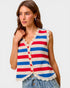 Woman wearing a red, white, and blue striped sleeveless top with lace trim on a plain background