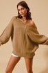 Woman wearing a brown fuzzy sweater against a beige background