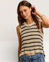 Woman wearing a striped sleeveless top with a plain background
