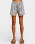 Light denim shorts worn by a person on a white background