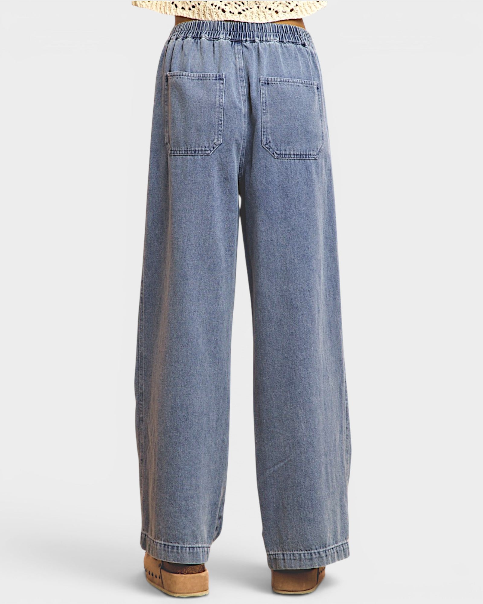 Blue wide-leg jeans on a white background