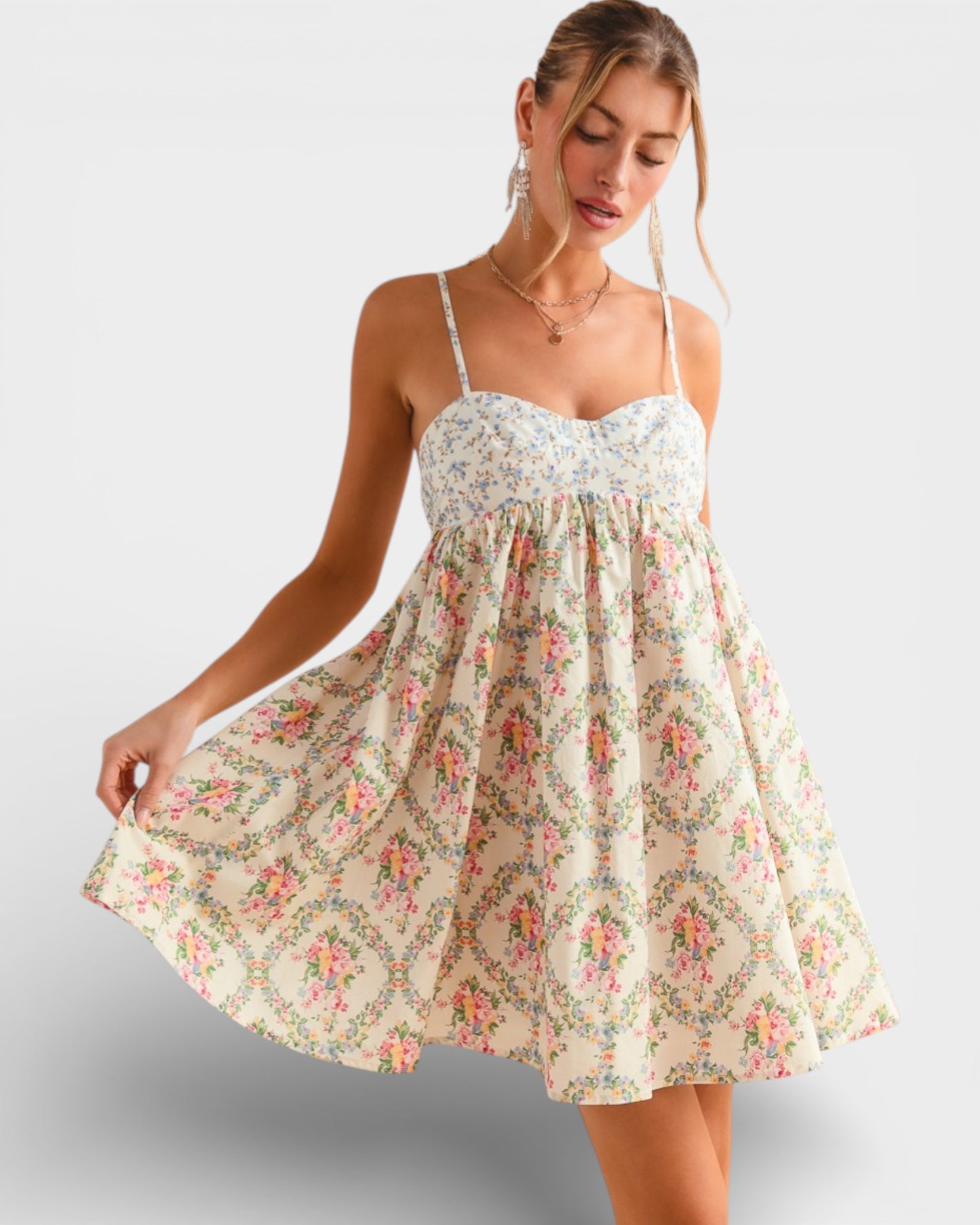 Woman wearing a floral dress on a plain background