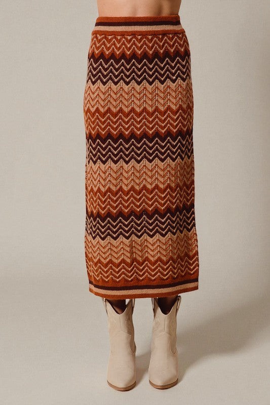 Patterned skirt worn by a person on a plain background