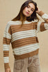 Woman wearing a brown and white striped sweater against a beige background