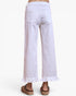 White wide-leg cropped pants with a ruffled hem, shown from the back on a model wearing brown sandals against a plain white background.