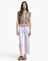 A woman modeling a sleeveless cropped vest with a tan and brown leopard print pattern over a beige button-front panel, paired with white wide-leg cropped pants and brown sandals, against a plain white studio background.