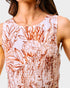 Close-up of a sleeveless top with floral pattern on a plain background