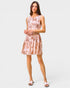 Woman wearing a floral dress on a white background