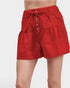 Red shorts with button details on a white background