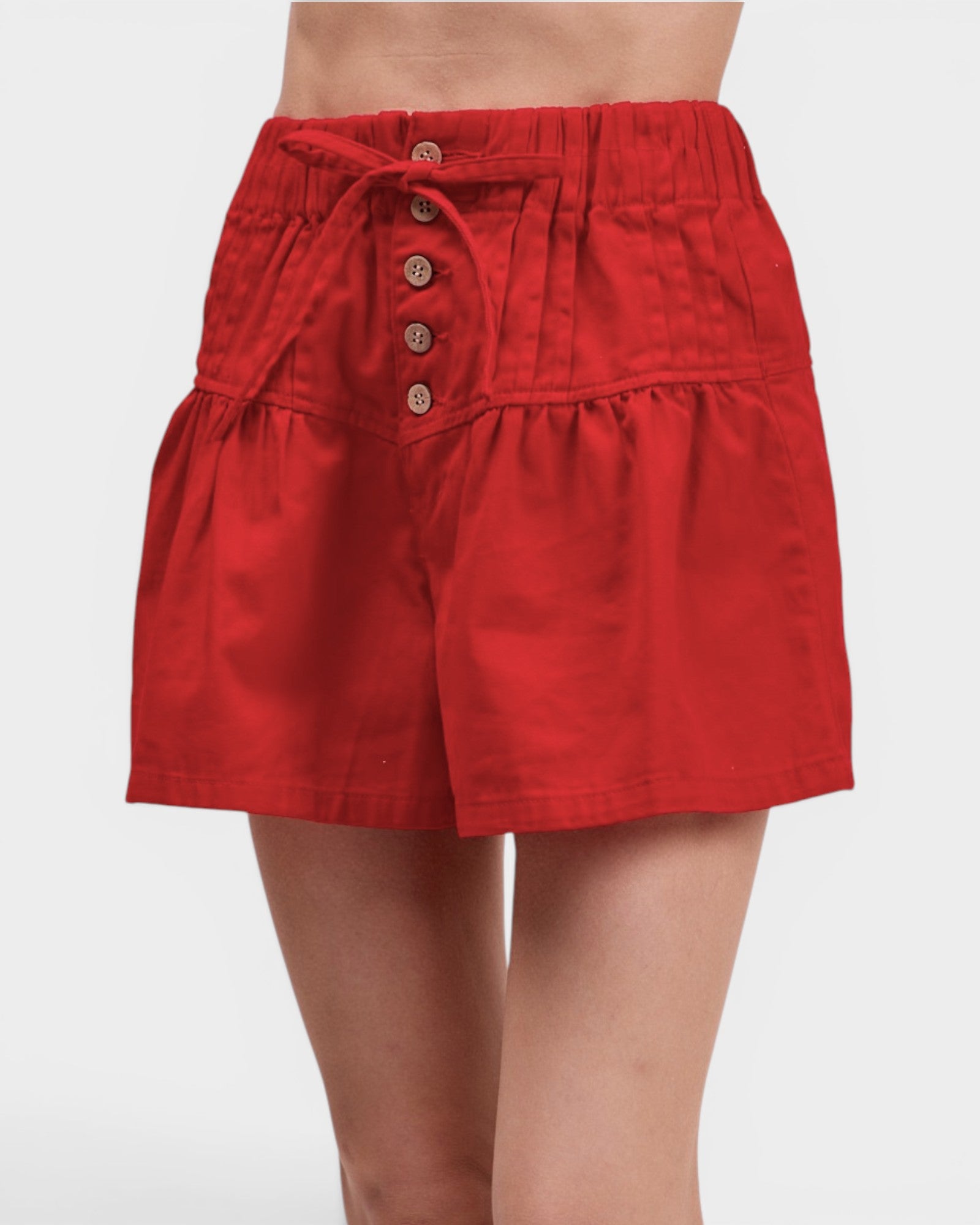 Red skirt with button details on a white background