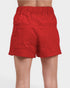Red shorts worn by a person on a white background