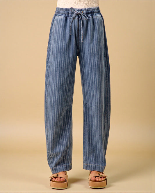 Blue striped pants on a beige background