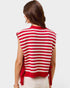 Red and white striped sleeveless sweater worn by a person on a light gray background