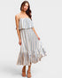 Woman wearing a striped dress on a white background