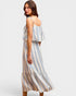 Woman wearing a striped dress on a plain background