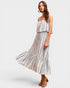 Woman wearing a striped dress with a white background
