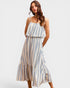 Woman wearing a striped dress on a white background