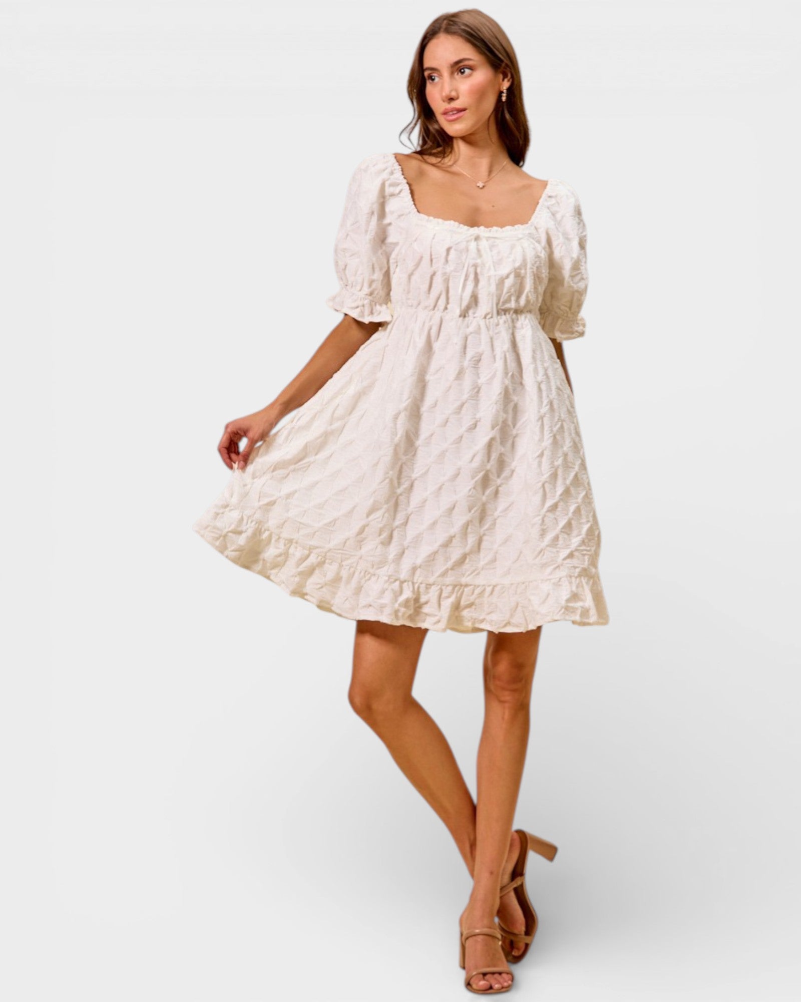 Woman wearing a white dress on a white background