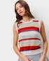 Woman wearing a colorful striped sleeveless sweater against a plain background