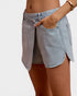 Light blue denim skirt worn by a person on a plain background