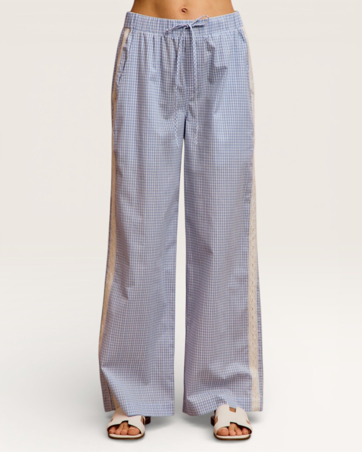 Blue checkered pants with a white background