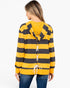 A woman shown from the back wearing a yellow and dark gray striped hooded sweatshirt with white laces down the center, paired with blue jeans, against a plain white background.