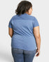 Person wearing a blue shirt and jeans on a white background