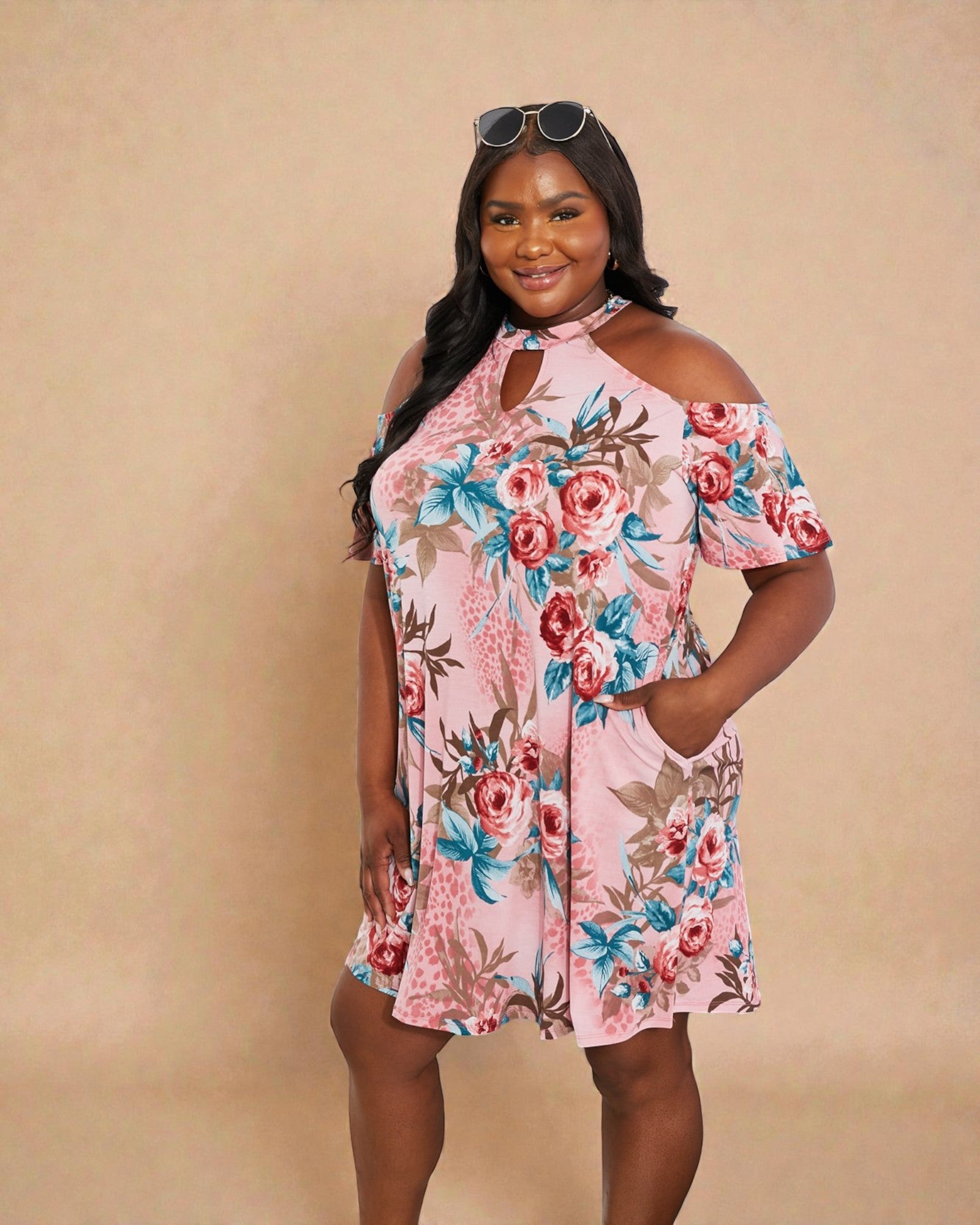 Woman wearing a floral dress against a beige background