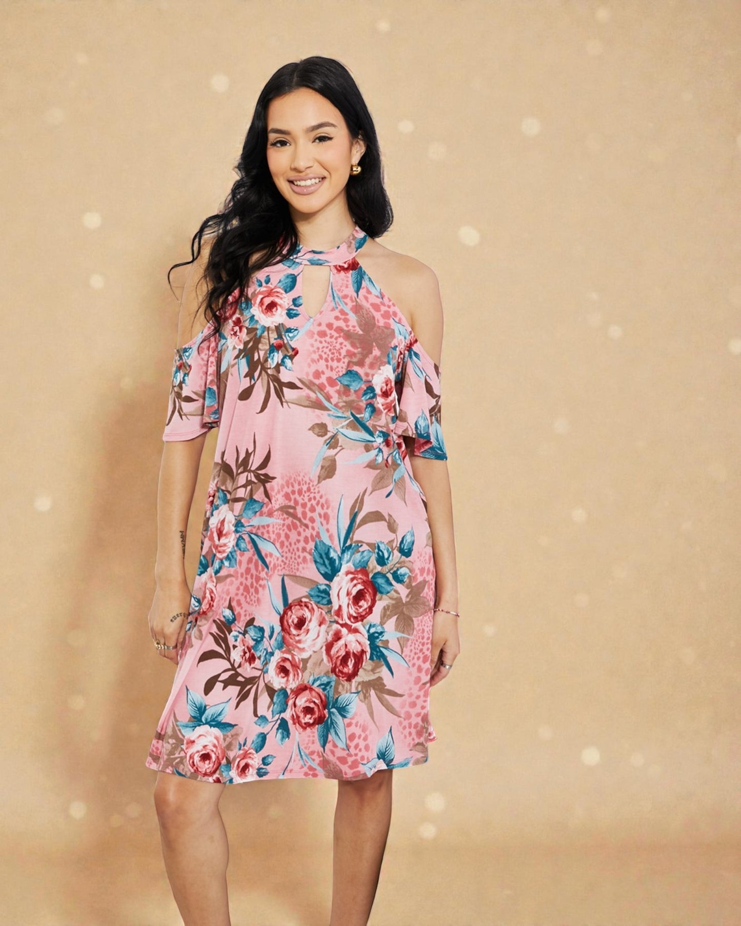 Woman wearing a pink floral dress against a beige background